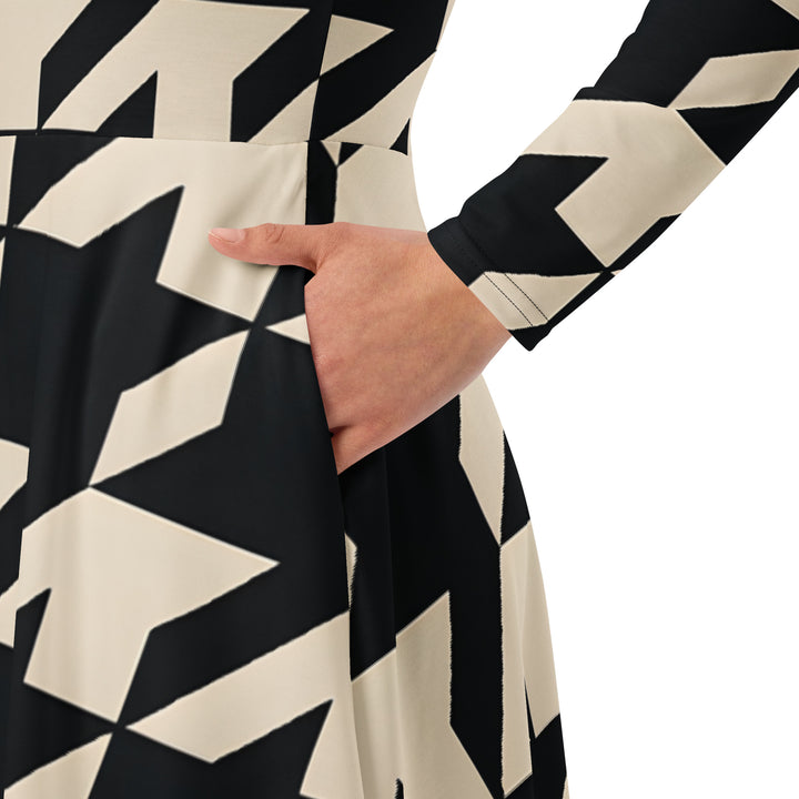 Gutsy Garb houndstooth midi dress close up showing hand in pocket long sleeve pleated skirt