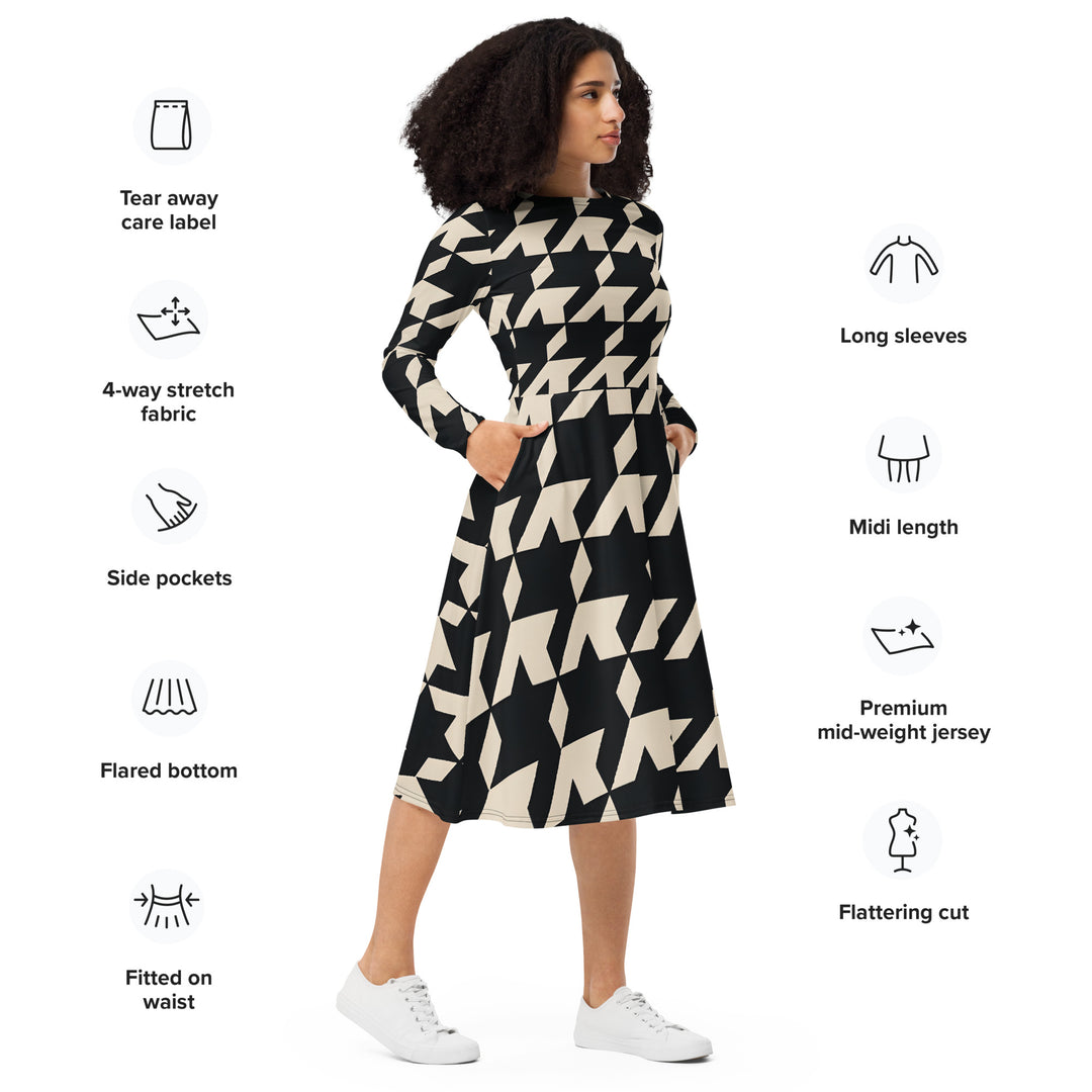 Gutsy Garb houndstooth midi dress in black and cream on model with long sleeves pockets flared skirt