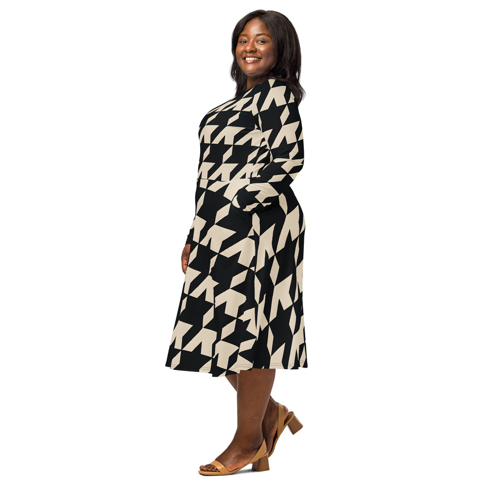 Plus size model wearing Gutsy Garb houndstooth midi dress with long sleeves A line fit and side pockets