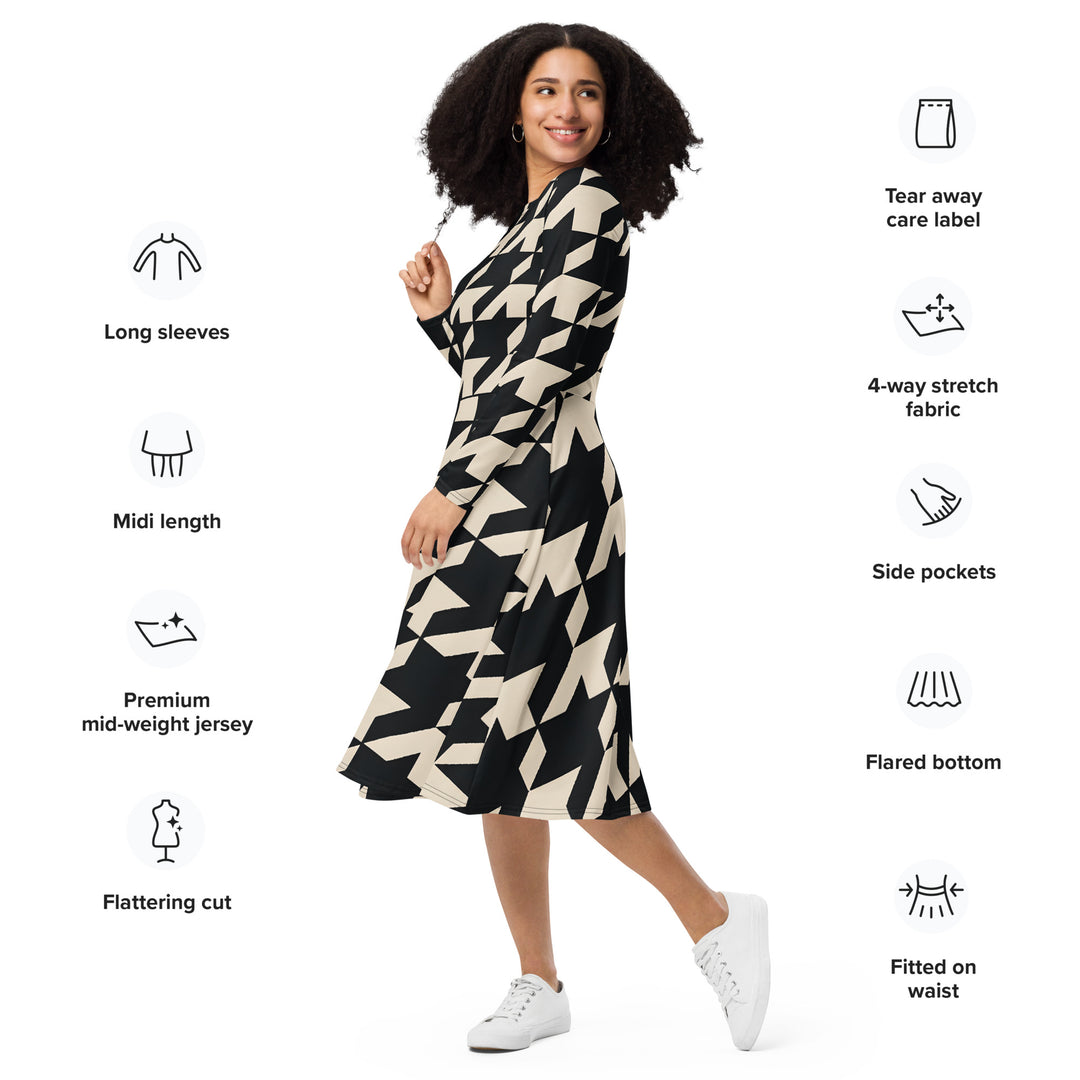 Gutsy Garb model wearing black and cream houndstooth midi dress with long sleeves flared hem and pockets
